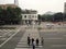 Auxiliary police leading pedestrians walking across the road.