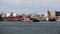 AVA M. McALLISTER tugboat passing Kill Van Kull strait westward on background of Bayonne, NJ