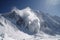 avalanche buries entire mountain range, with only peaks visible above the snow