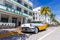 Avalon Hotel in Art Deco architecture style and classic car on Ocean Drive in Miami Beach Florida, United States