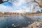 AVANOS, TURKEY - JAN 23, 2019: Goose ducks and swans near by wooden hanging bridge on snowy winter time in Kizilirmak river