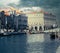 Aveiro Lagoon with traditional Moliceiro boats against the background of the cityscape