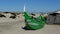 Aveiro, Portugal-DecembBoat stranded on the dune and broken wooden house.