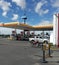 Avellaneda Commercial Center. Cars at the Shell gasoline station beside the highway. Sunny day