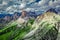 Averau peak in Dolomites and green hills, aerial view, Italy