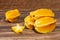 Averrhoa Carambolo - Star Fruit Or Carambola; Photo On Wooden Background