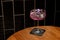 Aviation, drink with gin, lemon juice,maraschino liqueur and violet cream liqueur standing on bar counter