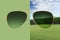 Aviator sunglasses isolated on green and on natural landscape with meadow, trees and sky background, concept of polarized