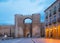 Avila - Gate Puerta del Alcazar and the town walls at dusk.