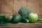 Avocado, apple, lime, celery, cucumber, broccoli, wooden rustic table background