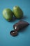 avocado beauty cream container on light green background