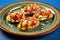 avocado bruschetta with sesame seeds on a blue rimmed plate