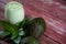 Avocado cream on the wooden surface with fresh fruits and leaves