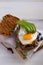 Avocado, egg and bacon sandwich. Fried egg and avocado on toast. Healthy tasty food.
