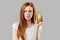 Avocado for healthy hair, girl is holding exotic fruit