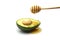 Avocado with honey dripping on white background