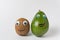 Avocado and kiwi with funny faces on white background. Products with Googly eyes