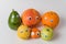 Avocado, lemon, Mandarin, Apple, grapefruit and orange characters with Googly eyes. Multinational family concept