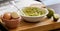 Avocado Mashing in a Bowl on Wooden Board