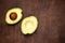 Avocado on old wooden table. Avocados background with copyspace.  Fruits healthy food concept. Top view