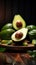 Avocado presentation on a wooden background with enticing dark atmosphere