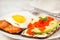 Avocado and red caviar, smoked salmon and fried egg rye toasts f