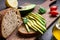 Avocado and rye bread toast on cutting board