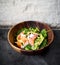 Avocado salmon salad healthy food in rustic style