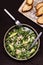 Avocado, Shrimp and Arugula Salad in a plate and toasts grill