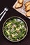 Avocado, Shrimp and Arugula Salad in a plate and toasts grill