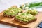 avocado slices on an open-faced sandwich on rye bread