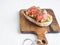 Avocado and smoked salmon toast on wood cutting board. Healthy food concept. Top view. Copy space