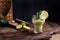 Avocado smoothie and lime in a glass. Food for health and beauty. Super food from vegetables and fruits. Wooden background, free