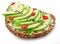 Avocado toast - bread with avocado slices, pieces of chilli pepper and black sesame isolated on white background