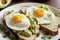 Avocado toast with poached egg on a wooden board, generative ai, healthy food. Breakfast concept