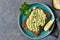 Avocado toast on whole grain bread, mashed avocado with sesame seeds and lime, healthy eating concept, top view