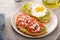 Avocado toasts with fried egg and heirloom tomatoes