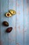 avocados, cut and uncut, on a light blue background of deteriorated wood