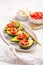 Avocados filled with bruschetta and balsamic vinaigrette - vegan appetizers