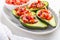 Avocados filled with bruschetta and balsamic vinaigrette - vegan appetizers