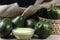 Avocados fruits and avocado cream in glass bowl on the wooden table