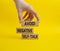 Avoid negative self-talk symbol. Concept words Avoid negative self-talk on wooden blocks. Beautiful yellow background. Businessman