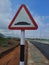 Avoiding a Speed bump sign on the asphalt road under blue sky