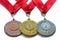 Award medals gold silver and bronze colors with red ribbons