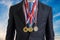 Awarded successful businessman is wearing many medals