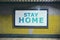 Awareness raising billboard with the message of stay home request at underground