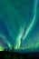 Awe-inspiring aurora borealis illuminating a night sky in Dawson City, Yukon Territory, Canada