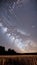 Awe-Inspiring Meteor Shower Streaking Across Starlit Sky