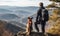 Awe-Inspiring View: Man Conquering Summit with Loyal Canine Companion