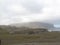 An awe-inspiring view of the mountains under cloudy skies in the Arctic